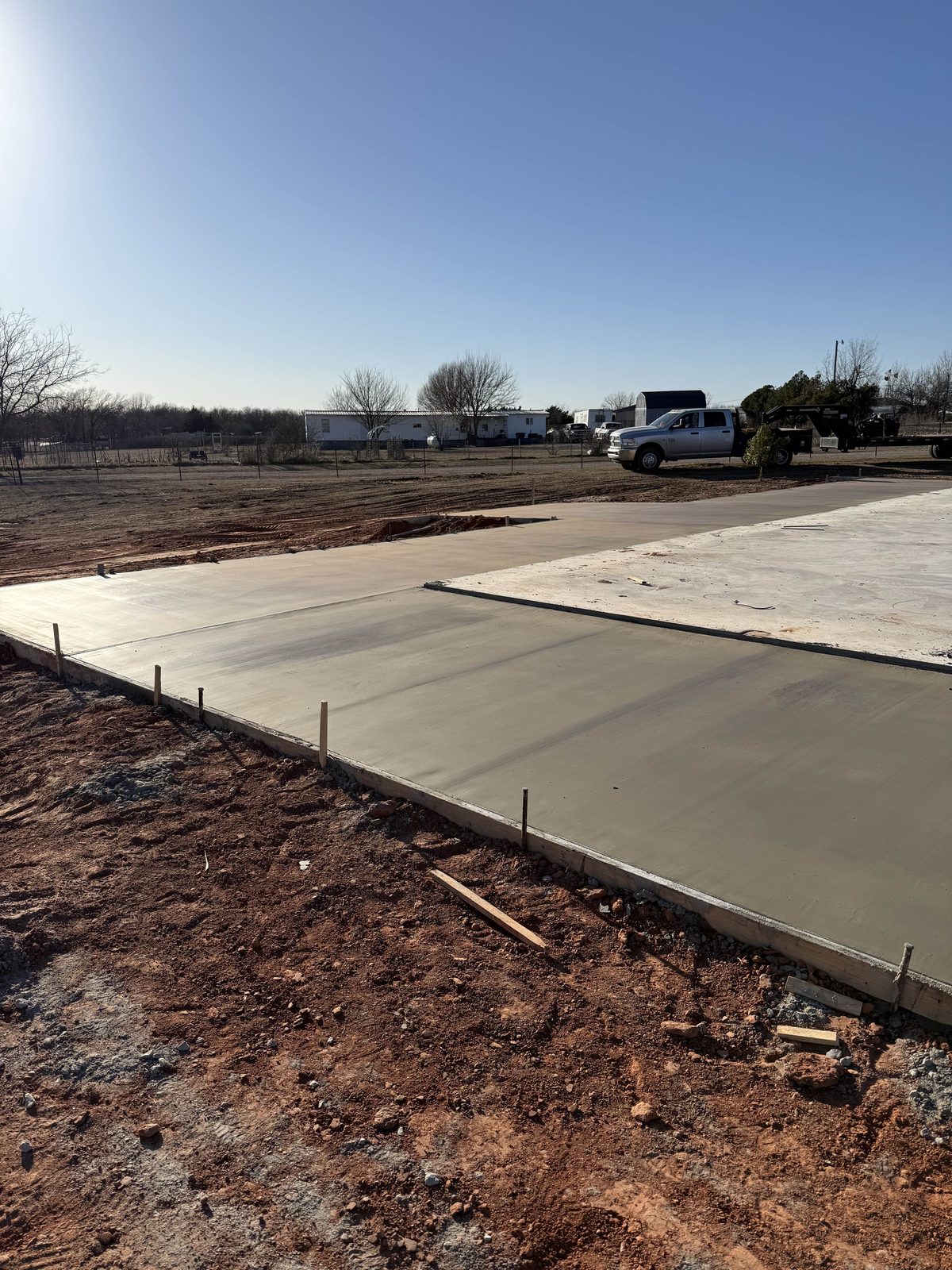A driveway poured in sections against an existing slab.